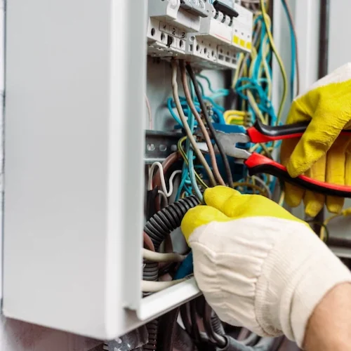 cropped view of workman in gloves holding pliers w 2026 01 06 00 24 39 utc