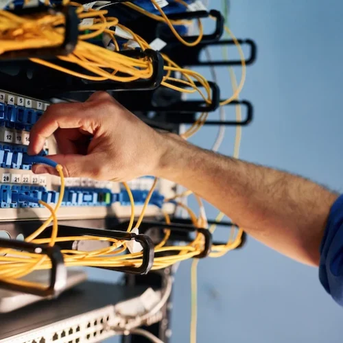 technician connecting cables to server in data cen 2026 03 24 06 11 01 utc